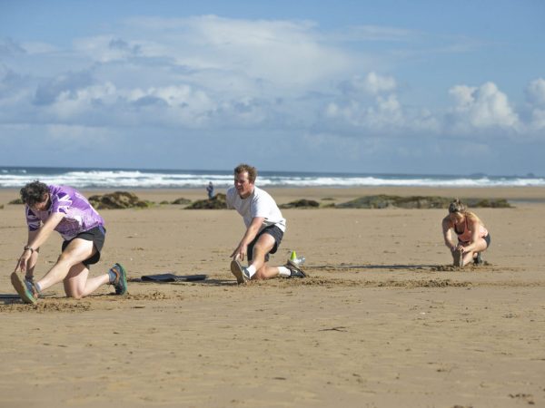Surfers at Watergate Bay on the north Cornwall coast